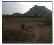 Project location with a hill in the back drop